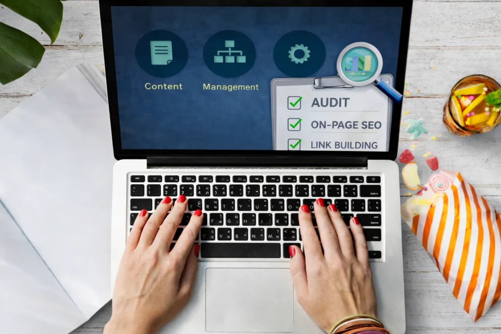 Business owner reviewing organic SEO services checklist on laptop screen with audit, on-page SEO, and link building elements